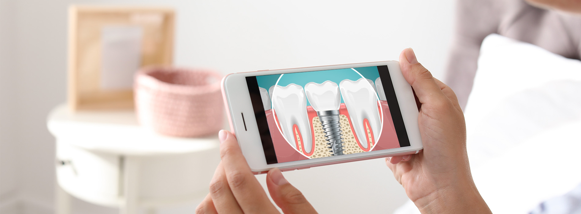 A person holding a smartphone displaying an image of a toothbrush and dental floss.